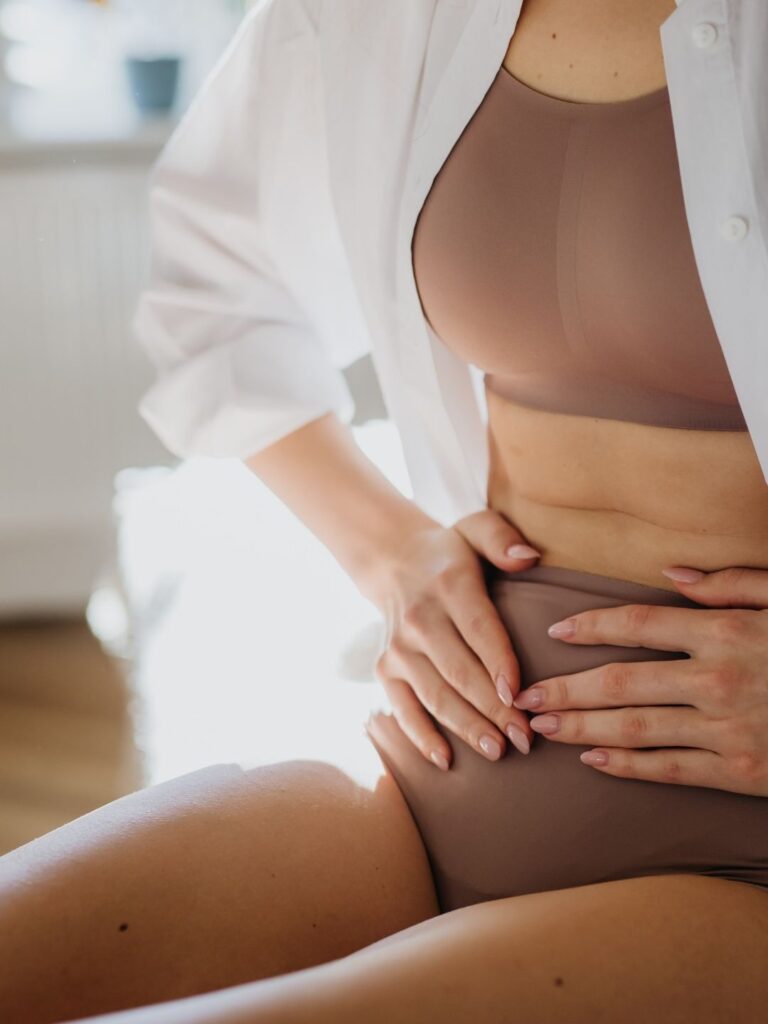 Woman holding stomach